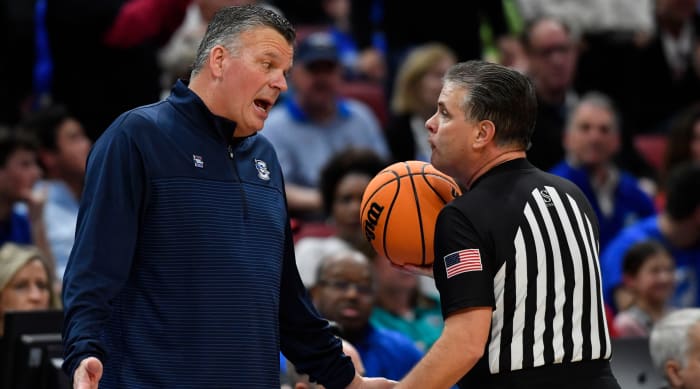 Creighton head coach Greg McDermott speaks with an official during a 2023 Elite Eight game against San Diego State